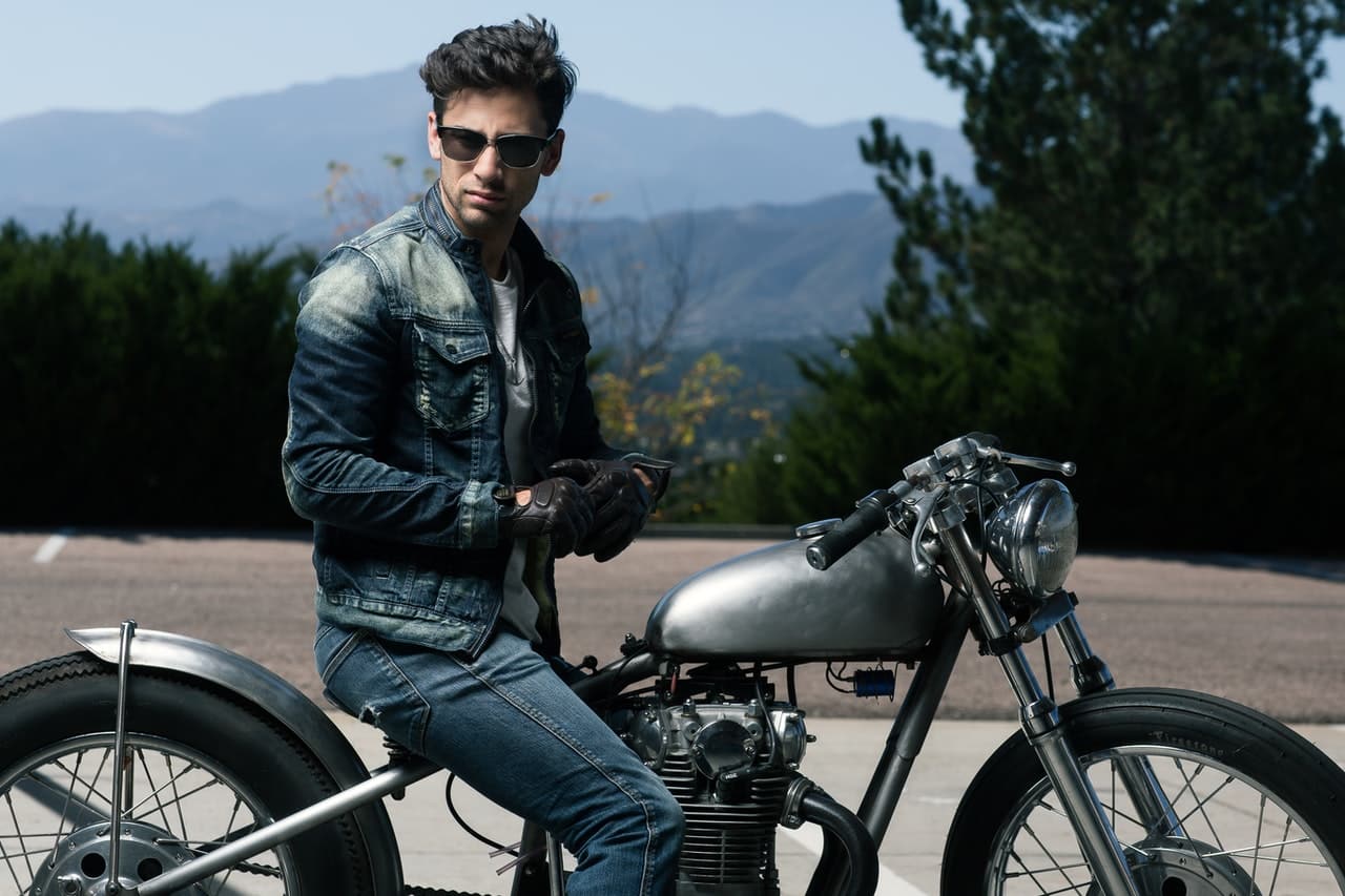 man in denim motorcycle jacket