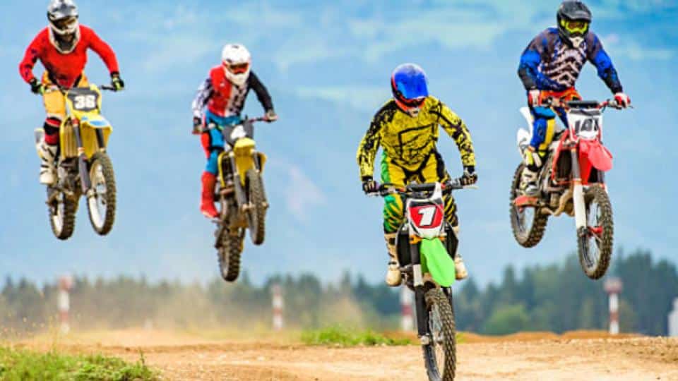 motocross riders on a high jump