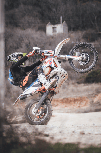 Lifted front wheel of the dirt bike