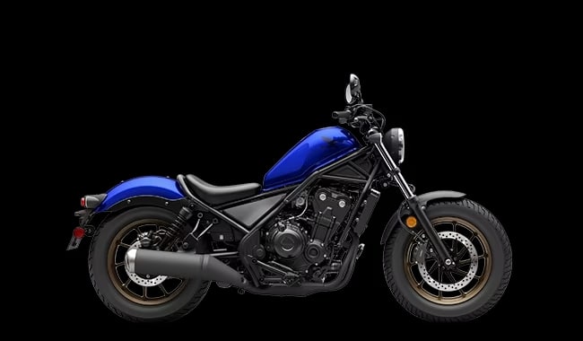 a blue and black motorcycle on a black background.