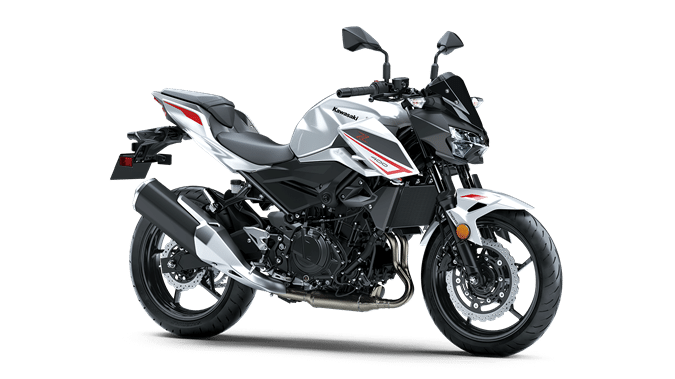a white and black motorcycle on a black background.