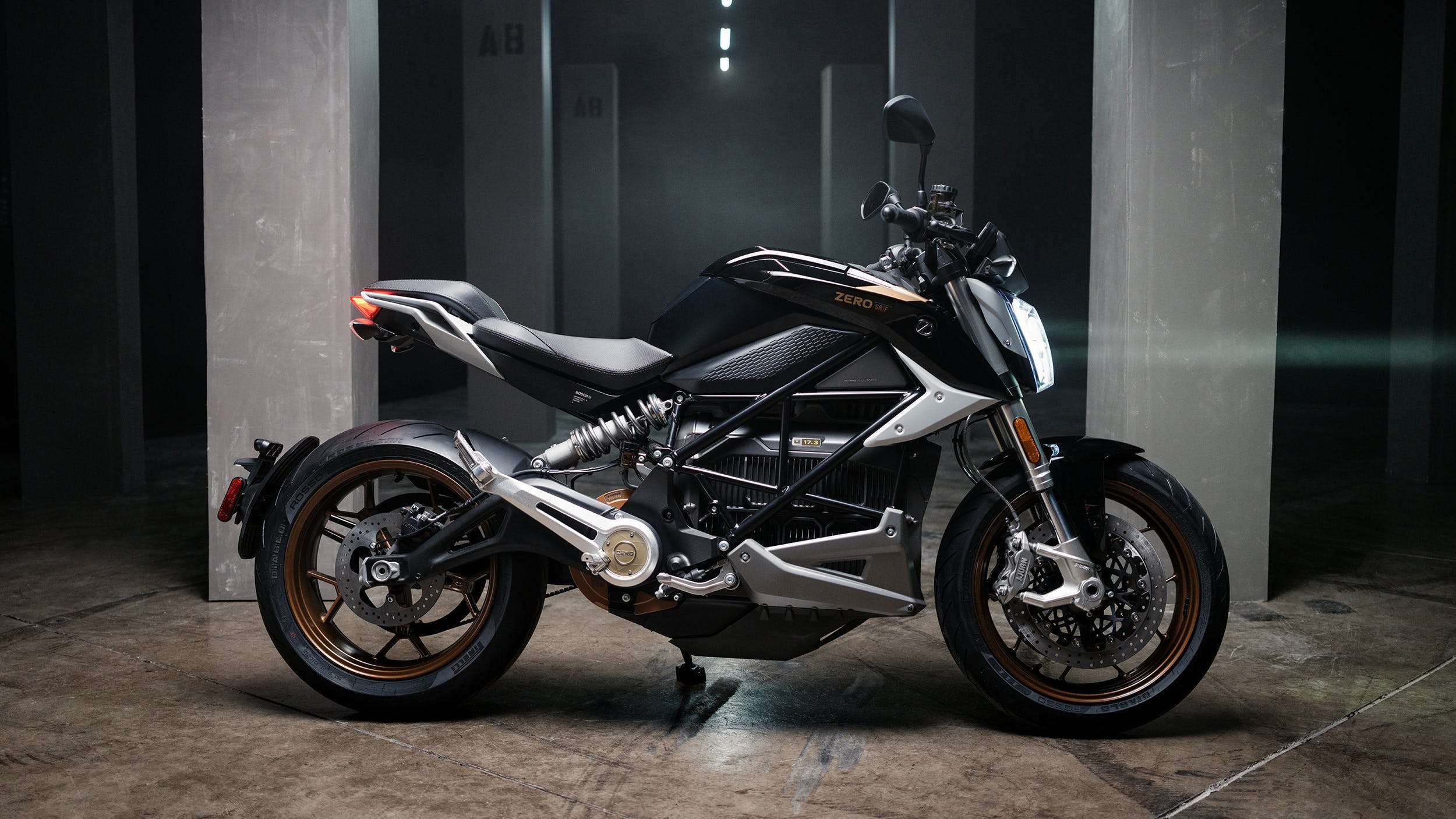a motorcycle is parked in a dimly lit room.